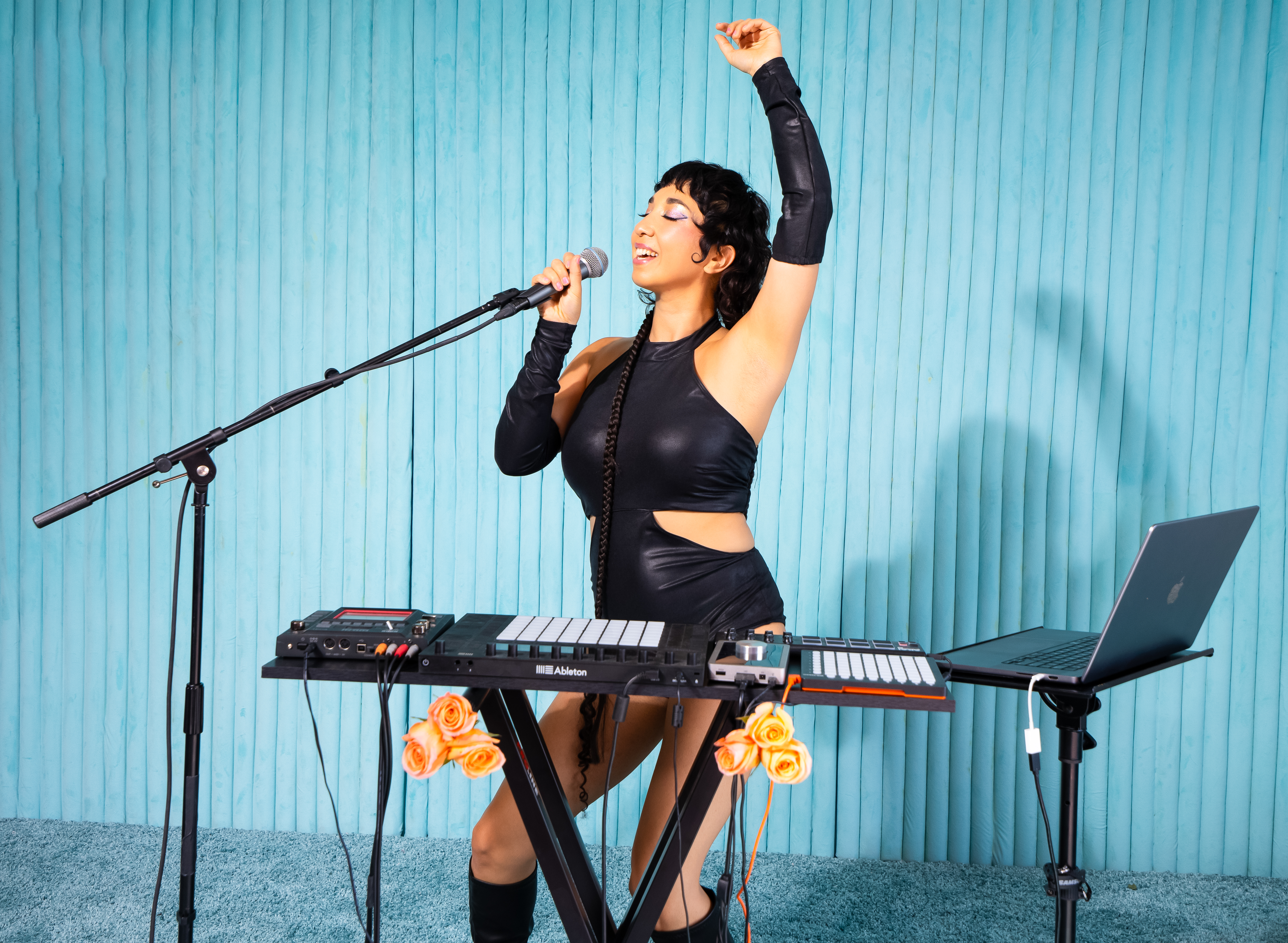 Live performance shot: Ruby Mountain as singer and electronic music producer.