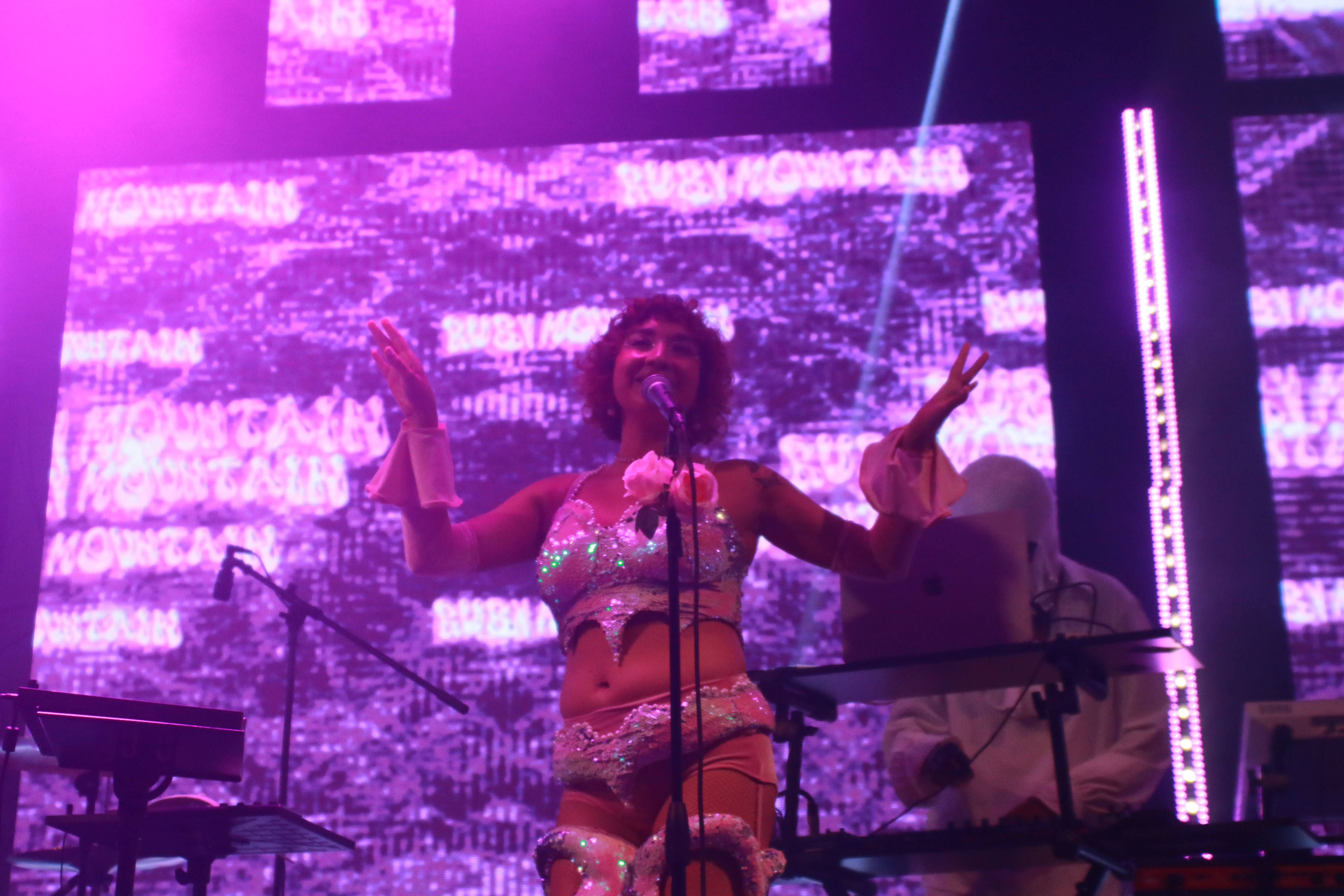 Ruby Mountain, interstellar artist from Venus, delivering an electrifying performance in Hollywood.